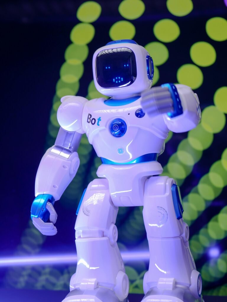 White humanoid robot showcasing modern technology with glowing backdrop.